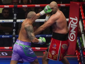 Tyson Fury and Oleksandr Usyk in action