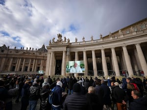 Pope Francis on large screen in front of faithful in St Peter's Square