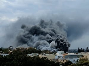 Smoke rises from a building following a fire in Taiwan