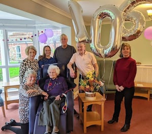 Ms Lear with her family on her 106th Birthday. 