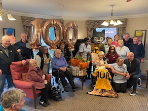 Joan with Steve Bull, Steve Daley, Phil Parkes, Joan's family, fellow residents, Wolfie the mascot and staff from Newcross Care Home