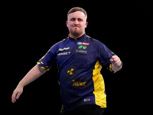 Luke Littler celebrates during his World Masters victory