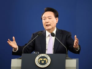 South Korean President Yoon Suk Yeol gestures during a speech