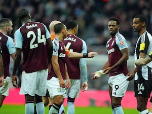 Jhon Duran stands motionless after receiving a red card