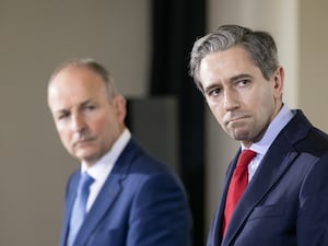 Fianna Fail leader Micheal Martin (left) and Fine Gael leader Simon Harris