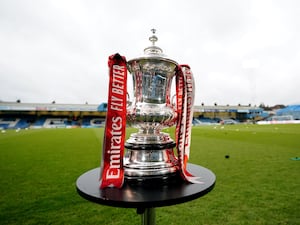 A view of the FA Cup on a football pitch