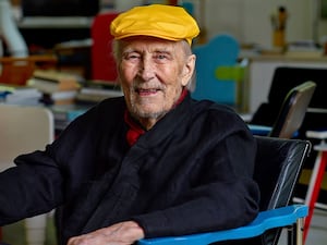 Yrjo Kukkapuro, a renowned Finnish furniture designer whose postmodern style of chairs graced waiting rooms and museums alike, sitting in his famous Experiment chair in his studio outside Helsinki