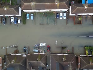 Aerial view of a road of houses in flood water