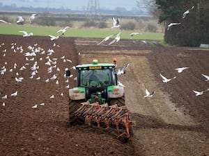 A tractor ploughs a field in North Yorkshire