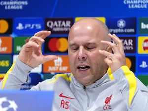 Liverpool manager Arne Slot holds his hands up in frustration