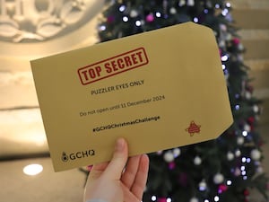 Top secret folder in front of Christmas tree