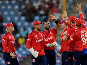 Saqib Mahmood, centre, celebrates a wicket