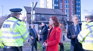 Sarah Coombes MP speaking with a police officer. 