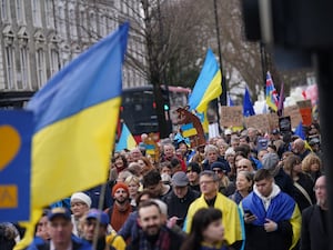 People taking part in a march from the St Volodymyr statue to the Russian embassy in central London