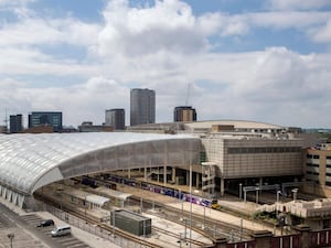 A general view of the Manchester Arena (right) and Victoria railway station