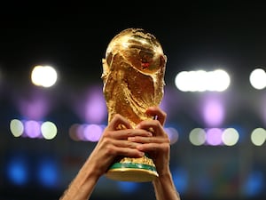 The men's football World Cup trophy is held aloft after the 2014 final in Brazil