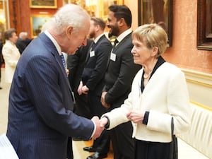 The King shaking hands with Nellie Hill