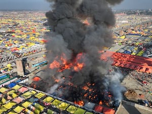 Vast area of flames amid tents