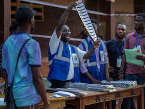 An election official in Ghana counting ballots