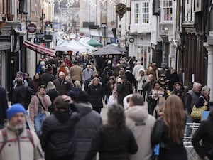 View of shoppers on a UK high street in December