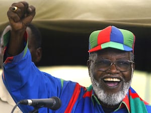 Sam Nujoma gestures while speaking during an election rally