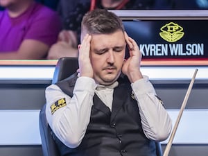 Kyren Wilson appears to struggle with a headache during his match at the UK Championship in York