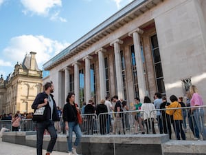 Fans queue up for a gig at The Halls