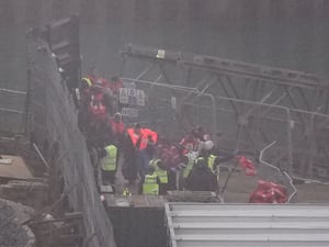 A group of people thought to be migrants are brought in to Dover