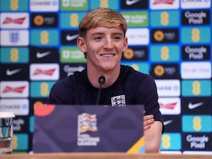 Anthony Gordon smiles during an England press conference