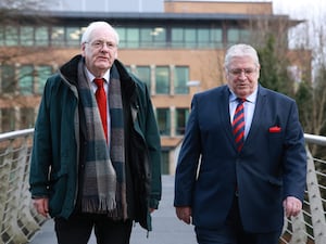 Michael Gallagher (left), the father of Aiden Gallagher, one of the victims of the Omagh bombing, arrives at the Strule Arts Centre in Omagh, Co Tyrone with Stanley McCombe (right), the husband of Ann McCombe, another victim of the bombing