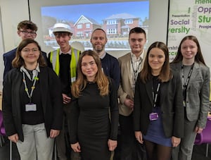 Students at The Friary School with members of the Redrow team