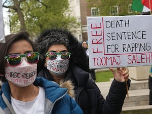 People protest in London in April after Iran imposed the death sentence on rapper Toomaj Salehi