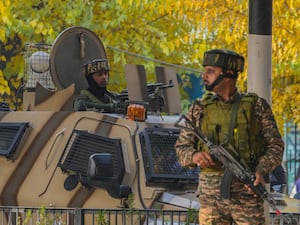 Indian paramilitary soldiers at the site of a grenade explosion at a marketplace in Srinagar, in Indian-controlled Kashmir