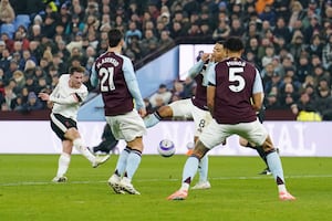 Aston Villa players block a shot from Liverpool's Diogo Jota