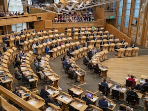 MSPs siting in the Holyrood debating chamber