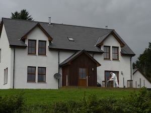 Forensic officers outside house