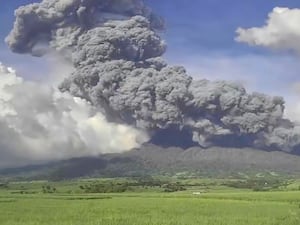 An explosive eruption at the summit vent of Kanlaon volcano, as seen from Mansalanao in Negros Occidental province, Philippines