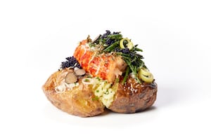 The potato features a lobster tail, caviar and truffles