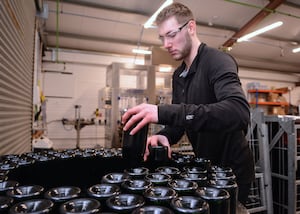 Harrison Crumb at work on the bottling line at Halfpenny Green Wine Estate on Tuesday, February 4, 2025.