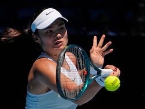 Emma Raducanu plays a forehand at the Australian Open