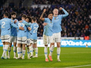 Manchester City players celebrate at Leicester