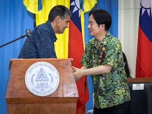 Taiwanese President Lai Ching-te, right, is greeted by Palau’s President Surangel Whipps Jr in Palau