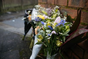 Tributes have been left outside the house on Elm Road