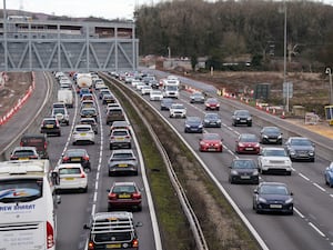 Traffic travelling on a three-lane motorway