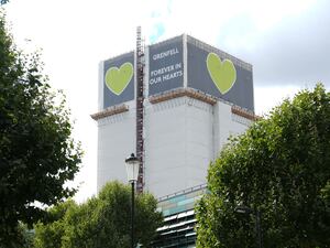 Grenfell Tower covered in tarpaulins