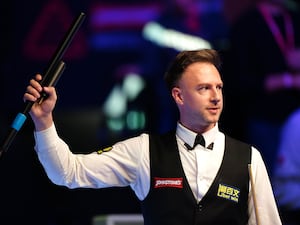 Judd Trump celebrates victory following the quarter-final match against Ding Junhui on day six of the 2025 Johnstone’s Paint Masters at Alexandra Palace