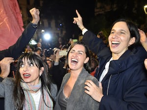 Centre-left candidate Stefania Proietti, left, celebrates with Democratic Party leader Elly Schlein, right, following regional elections