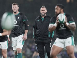 Andy Farrell, centre, watches Ireland warm up