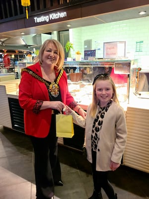 Freya Geraghty receives her goodie bag from the Mayor