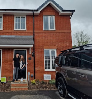 First time buyers Callum Hughes and Emma Lainchbury outside their new Elan home